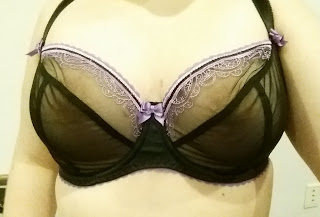 Someone wearing a bra with an incorrect apex position