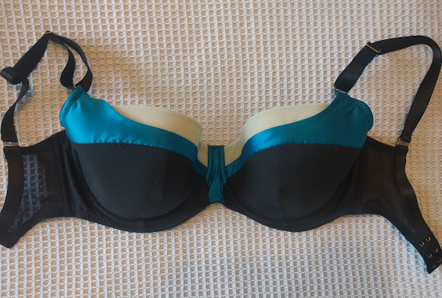 The Lottie laid out on a bed so the front of the bra is visible