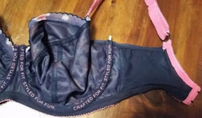 A bra with the underwire poking out of its casing